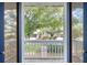 A charming balcony with views of lush greenery and a brick walkway leading to the house at 5011 S Elberon St, Tampa, FL 33611