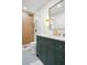 Beautiful bathroom featuring a modern vanity, gold fixtures, and a stylish walk-in shower at 5011 S Elberon St, Tampa, FL 33611