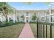 Beautiful townhouse with a red brick pathway and lush green lawn at 5011 S Elberon St, Tampa, FL 33611