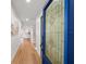 Inviting foyer with hardwood floors and a blue stained-glass front door at 5011 S Elberon St, Tampa, FL 33611