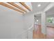 Bright upstairs hallway with hardwood floors, and exposed beams at 5011 S Elberon St, Tampa, FL 33611