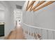 Bright hallway with wooden floors and exposed wooden beams on the ceiling at 5011 S Elberon St, Tampa, FL 33611