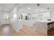 Bright kitchen with white cabinetry, quartz countertops, and stainless-steel appliances at 5011 S Elberon St, Tampa, FL 33611