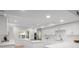Stylish white kitchen with modern appliances and abundant natural light at 5011 S Elberon St, Tampa, FL 33611