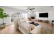 Inviting living room with a comfortable sofa, stylish decor, and sliding glass doors with pool access at 5011 S Elberon St, Tampa, FL 33611