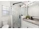 Updated bathroom with glass shower, vanity, and modern finishes at 5305 Coronet Rd, Plant City, FL 33566