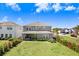 The backyard boasts a well-maintained lawn with a patio, offering plenty of space for outdoor activities and relaxation at 5407 Tagalong Pl, Apollo Beach, FL 33572