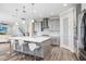 Spacious kitchen with a large island, pendant lighting, and sleek stainless steel appliances, perfect for modern living at 5407 Tagalong Pl, Apollo Beach, FL 33572