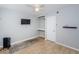 Bedroom with wood floors, TV, and natural light from the window at 6264 Dorset Rd, Spring Hill, FL 34608