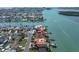 Expansive waterfront home with boat docks, lush landscaping, and neighborhood views at 700 126Th Ave, Treasure Island, FL 33706