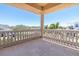 Spacious balcony with decorative railings offers expansive views of the neighborhood and lush greenery at 700 126Th Ave, Treasure Island, FL 33706