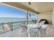 Spacious covered balcony provides water views and seating area, ideal for outdoor relaxation and entertaining at 700 126Th Ave, Treasure Island, FL 33706