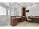 Bathroom with large vanity area, granite countertop, and glass block window at 700 126Th Ave, Treasure Island, FL 33706