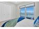 Bright Bedroom with sliding glass door to a balcony offering gorgeous water views at 700 126Th Ave, Treasure Island, FL 33706