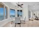 Breakfast nook with water view featuring ceiling fan, table, and modern chairs at 700 126Th Ave, Treasure Island, FL 33706