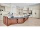 Large kitchen island with granite countertops, custom cabinetry, and stainless-steel appliances at 700 126Th Ave, Treasure Island, FL 33706