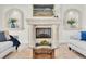 Bright living room features neutral tones, a fireplace, and upscale decor at 700 126Th Ave, Treasure Island, FL 33706