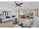 Spacious living area seamlessly connects to an open-concept kitchen with neutral tones and luxe decor at 700 126Th Ave, Treasure Island, FL 33706