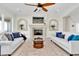 Bright living room features neutral tones, a fireplace, and upscale decor at 700 126Th Ave, Treasure Island, FL 33706