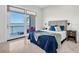 Bedroom with patio, water view, and an abundance of natural light at 700 126Th Ave, Treasure Island, FL 33706