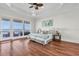 Waterfront main bedroom features water views, hardwood floors, and tray ceiling at 700 126Th Ave, Treasure Island, FL 33706