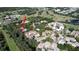 An aerial view shows the property nestled in a lush golf course community with pools, lakes, and well-maintained landscaping at 700 Starkey Rd # 821, Largo, FL 33771