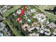 Beautiful aerial view of a community with a golf course, pool, and mature trees surrounding the property at 700 Starkey Rd # 821, Largo, FL 33771