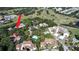 An aerial shot displays a community on a golf course with a pool, lakes, and lots of green space and trees at 700 Starkey Rd # 821, Largo, FL 33771