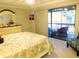 Bright bedroom featuring a view of the balcony and comfortable seating at 700 Starkey Rd # 821, Largo, FL 33771