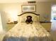 Comfortable bedroom setup featuring a teddy bear on the bed and coordinated nightstands at 700 Starkey Rd # 821, Largo, FL 33771
