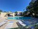 Relax by the community pool with lounge chairs and beautiful landscaping at 700 Starkey Rd # 821, Largo, FL 33771