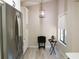 Bright dining area with a hanging pendant lamp, adjacent to kitchen at 700 Starkey Rd # 821, Largo, FL 33771