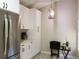 Bright dining area with a hanging pendant lamp, adjacent to kitchen at 700 Starkey Rd # 821, Largo, FL 33771