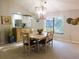 Dining room showcases a modern table and stylish decor, bathed in natural light at 700 Starkey Rd # 821, Largo, FL 33771