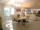Bright dining area with natural light and vaulted ceiling, open to living area at 700 Starkey Rd # 821, Largo, FL 33771