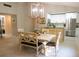 Well-lit dining area with modern decor, seamlessly flowing into the kitchen space at 700 Starkey Rd # 821, Largo, FL 33771