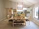 Open dining room connected to the kitchen, featuring a modern table and ample natural light at 700 Starkey Rd # 821, Largo, FL 33771