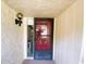 Close up of the front door featuring a screen door and wall lighting at 700 Starkey Rd # 821, Largo, FL 33771