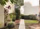 Pathway between buildings lined with colorful foliage and plants at 700 Starkey Rd # 821, Largo, FL 33771