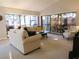Inviting living room featuring vaulted ceiling, comfortable seating, and a sunroom at 700 Starkey Rd # 821, Largo, FL 33771