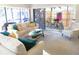 Bright living room with comfortable seating and sliding glass doors to the outside at 700 Starkey Rd # 821, Largo, FL 33771