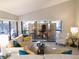 Comfortable living room featuring vaulted ceiling, comfortable seating, and a sunroom at 700 Starkey Rd # 821, Largo, FL 33771