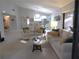 Spacious living room with neutral decor, vaulted ceiling, and view of the kitchen at 700 Starkey Rd # 821, Largo, FL 33771