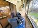 Cozy screened patio with comfortable seating area and outdoor decor at 700 Starkey Rd # 821, Largo, FL 33771