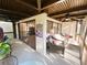 Covered patio with comfortable seating, ceiling fans, and views of the property and greenery at 700 Starkey Rd # 821, Largo, FL 33771