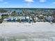 Scenic beachfront community with residential homes, white sandy beach, and tranquil bay waters at 812 Gulf # 3, Indian Rocks Beach, FL 33785