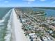 Expansive aerial view of beachfront property featuring ocean views, coastal homes and sandy shorelines at 812 Gulf # 3, Indian Rocks Beach, FL 33785