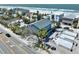 Picturesque oceanfront home with palm trees and nearby development, offering beachside living at 812 Gulf # 3, Indian Rocks Beach, FL 33785