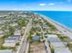 Gorgeous aerial view highlighting the coastal neighborhood with beautiful homes near the sandy beach and ocean at 812 Gulf # 3, Indian Rocks Beach, FL 33785