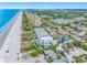 Expansive aerial view of beachfront condos and homes along the beautiful coastline with pristine sands at 812 Gulf # 3, Indian Rocks Beach, FL 33785